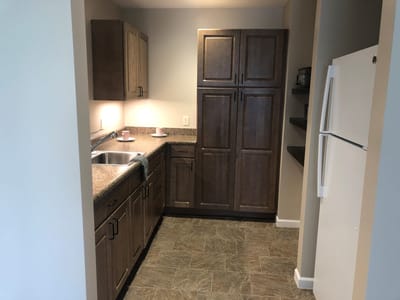 Modern kitchen with granite countertops and wooden cabinets