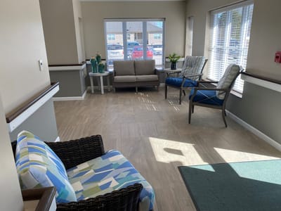Bright common area with seating and natural light