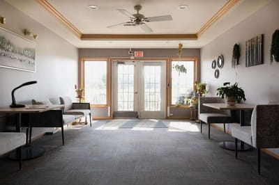 Bright common area with seating and plants
