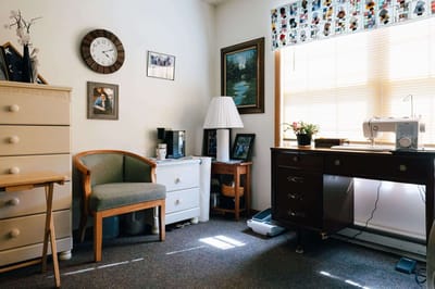 Cozy resident room with furniture and personal touches