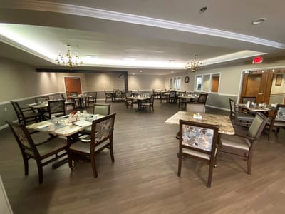 Dining area with tables set for meal service