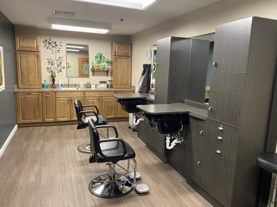 Interior of a hair salon with styling chairs and mirrors