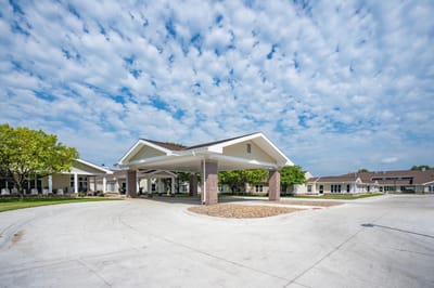 Entrance area of Prairie Village Retirement Center with covered entrance and architecture