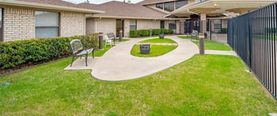Well-maintained outdoor area with seating and pathways