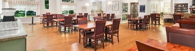 Dining area with empty tables and chairs