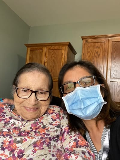 Caregiver with a resident smiling for a selfie