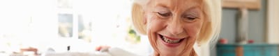 Parkwood Independent Living, independent living in Bedford, TX — Smiling senior woman in a bright living room
