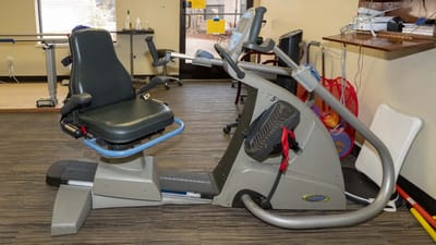 Therapeutic exercise equipment in an interior gym area