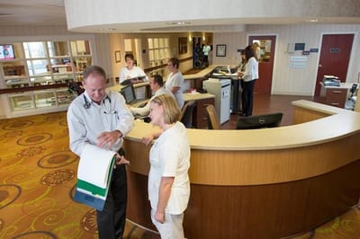 Staff interacting in a welcoming reception area