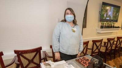 Staff member in a common area during an activity