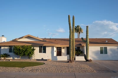 Exterior view of a senior living facility with landscaping
