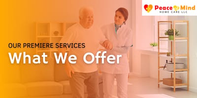 Caregiver assisting an elderly man indoors