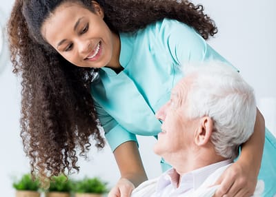 Healthcare worker interacting with an elderly resident