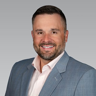 Accent Care – Portland, hospice care in Portland, OR — Professional headshot of a smiling man in a suit
