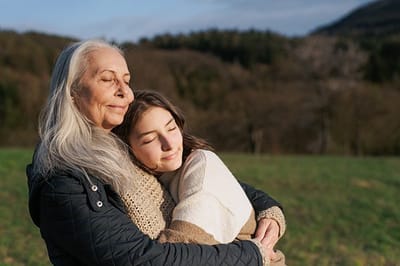 AccentCare Hospice & Palliative Care-Hillsborough County, hospice care in Tampa, FL — Elderly woman embracing a young girl in nature
