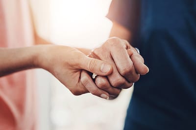 Accent Care – Portland, hospice care in Portland, OR — Two hands holding each other gently in sunlight