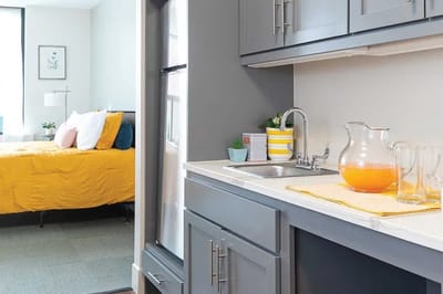 Cozy interior of a resident's suite with kitchenette.