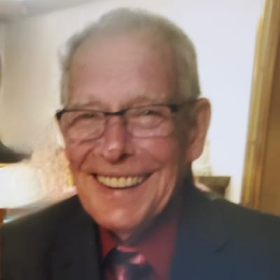 Smiling elderly man in a suit