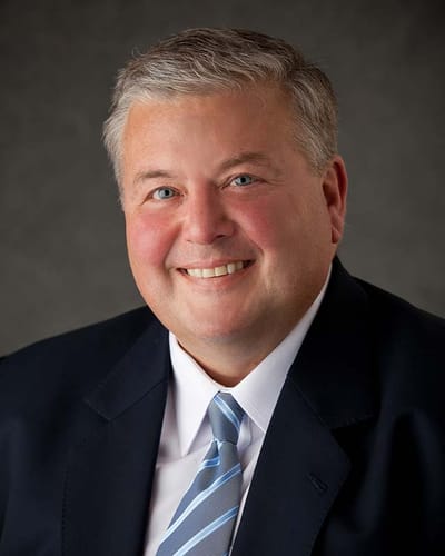 Portrait of a smiling man in a suit