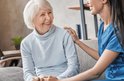 Resident enjoying conversation with staff member