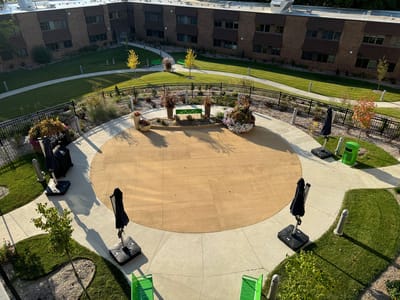 Outdoor recreational area with garden and seating