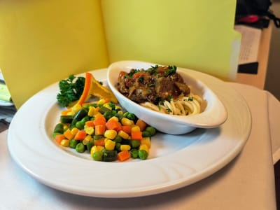 Plate of chicken pasta with mixed vegetables