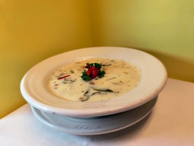 Creamy soup garnished with vegetables