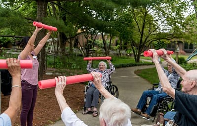 Residents participating in an outdoor exercise activity.