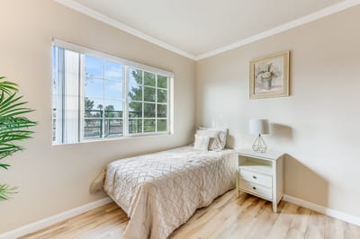 Cozy resident room with a bed and window