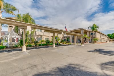 Exterior view of the facility with landscaping.