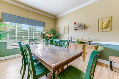 Bright, inviting common area with dining table.