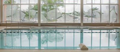 Indoor pool area with large windows