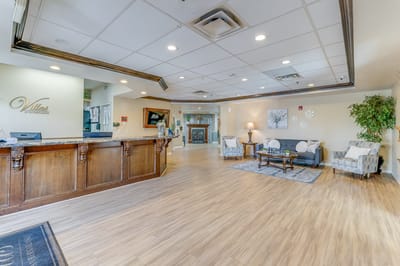 Welcoming lobby area with seating and a reception desk.