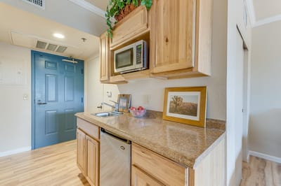 Interior kitchen area with wooden cabinets