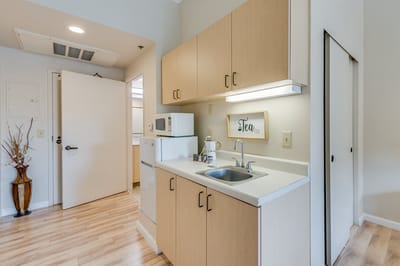 A kitchenette area in a resident room
