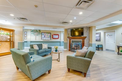 Common seating area with comfortable chairs and decorations.