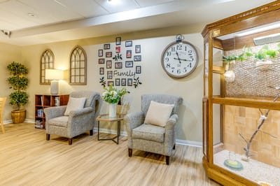 Cozy common area with chairs and family photos