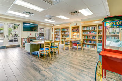 Cozy common area with bookshelves and seating