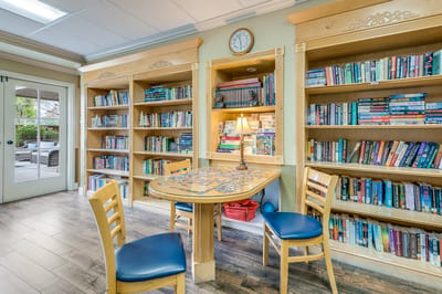 Cozy reading area with shelves and a puzzle table