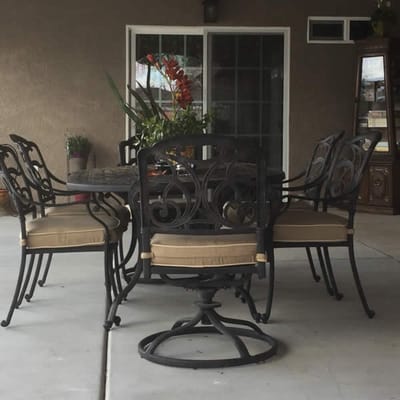 Outdoor seating area with a table and chairs.