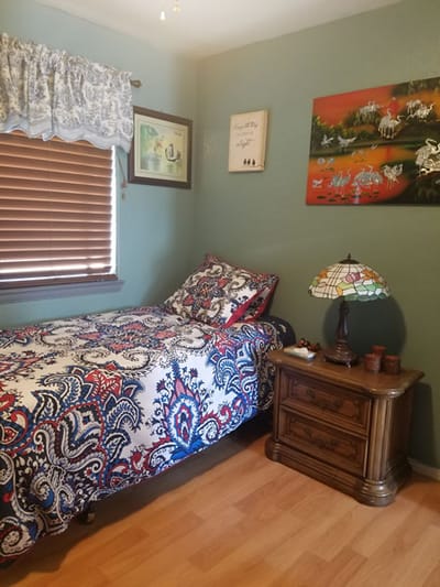 Cozy private resident room with a bed and decor.