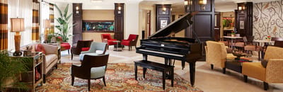 Elegant common area with piano and seating