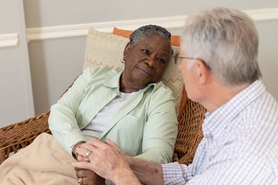 Residents engaging in a conversation in a cozy setting