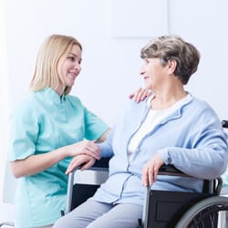 All Ways Caring HomeCare – Missoula, home care in Missoula, MT — Caregiver assisting a senior woman in a wheelchair