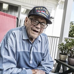 All Ways Caring HomeCare – Missoula, home care in Missoula, MT — Senior veteran wearing a cap on a porch