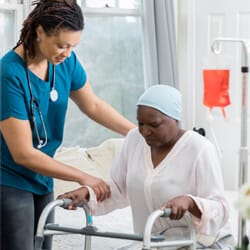 All Ways Caring HomeCare – Missoula, home care in Missoula, MT — Caregiver assisting a senior woman with a walker