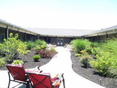 Outdoor courtyard with seating and greenery