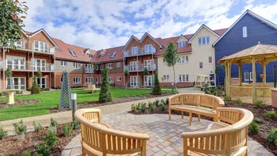 Outdoor space with gardens and seating at the facility
