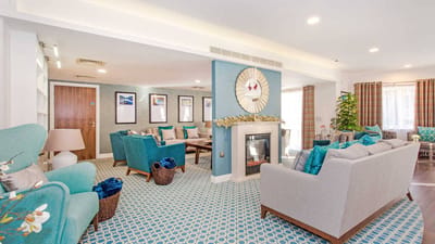 Cozy common area with comfortable seating and a fireplace