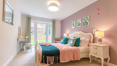 Cozy interior of a resident room with a bed and decor